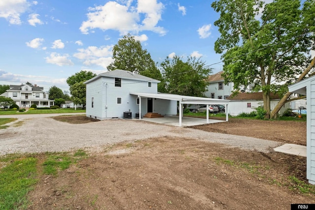 316 N 13th St, Tekamah, NE 68061 - view of front of home featuring dirt driveway, entry steps, and a detached carport