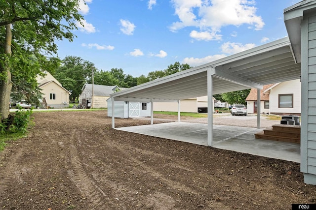 316 N 13th St, Tekamah, NE 68061 - view of vehicle parking featuring a carport