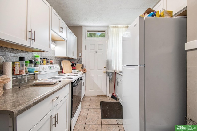 1100/1102 S 35th Ave, Omaha, NE 68105 - kitchen featuring white appliances, light tile patterned floors, white cabinetry, tasteful backsplash, and a textured ceiling