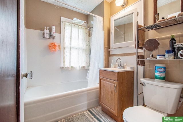 1100/1102 S 35th Ave, Omaha, NE 68105 - bathroom with shower / bathtub combination with curtain, vanity, and tile walls