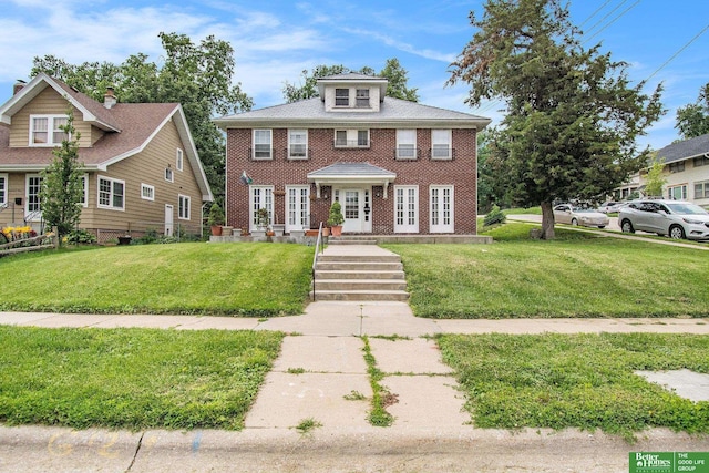 1100/1102 S 35th Ave, Omaha, NE 68105 - view of front of home with a front lawn, french doors, and brick siding