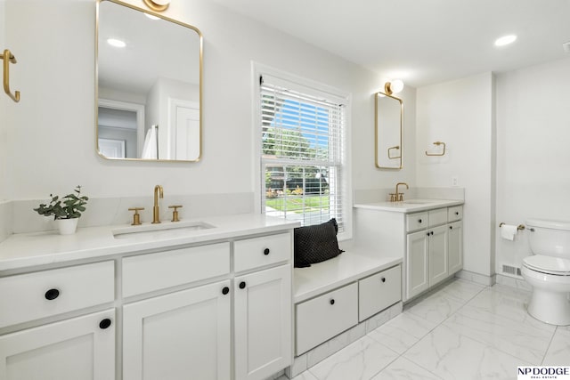 2525 N 55th St, Omaha, NE 68104 - bathroom featuring vanity, marble finish flooring, and recessed lighting