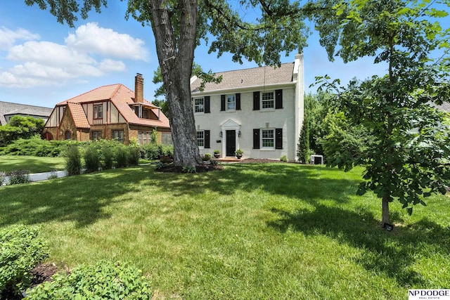 2525 N 55th St, Omaha, NE 68104 - view of front of house with a chimney and a front lawn