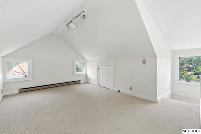 2525 N 55th St, Omaha, NE 68104 - additional living space with baseboard heating, lofted ceiling, carpet, and plenty of natural light
