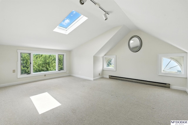 2525 N 55th St, Omaha, NE 68104 - additional living space with a baseboard radiator, lofted ceiling, carpet floors, and a skylight