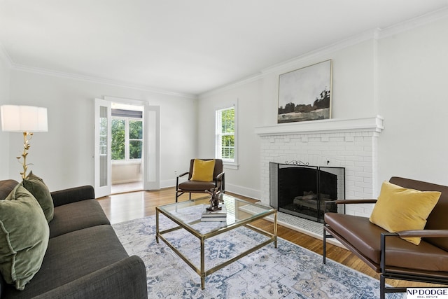 2525 N 55th St, Omaha, NE 68104 - living room with ornamental molding, wood finished floors, and a brick fireplace
