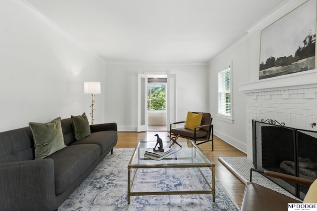2525 N 55th St, Omaha, NE 68104 - living room with ornamental molding, wood finished floors, and a brick fireplace
