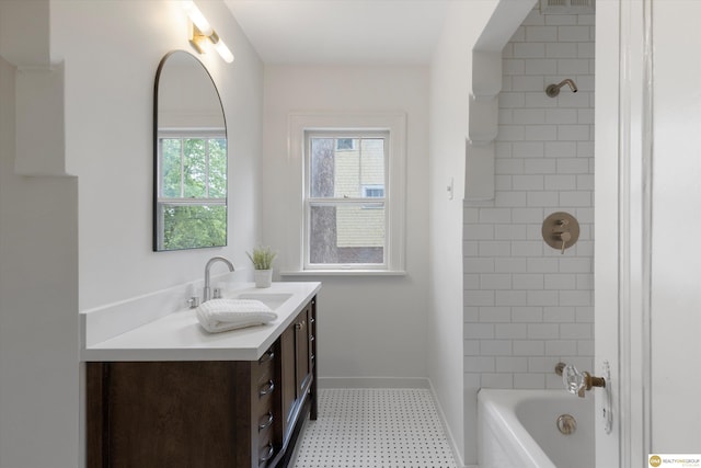 2518 N 56th St, Omaha, NE 68104 - bathroom with vanity, tile patterned floors, and shower / tub combination