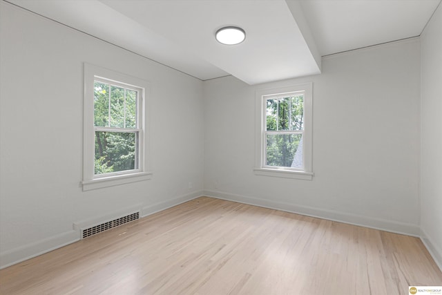 2518 N 56th St, Omaha, NE 68104 - empty room with wood finished floors and healthy amount of natural light