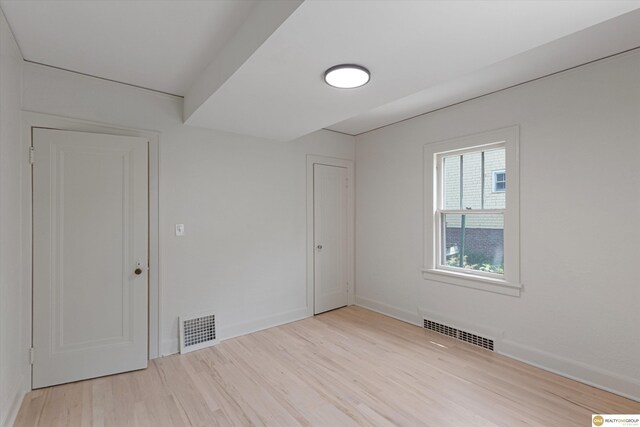 2518 N 56th St, Omaha, NE 68104 - unfurnished bedroom featuring wood finished floors and baseboards