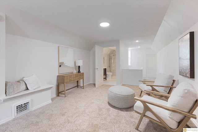 2518 N 56th St, Omaha, NE 68104 - living area featuring lofted ceiling, carpet floors, and recessed lighting