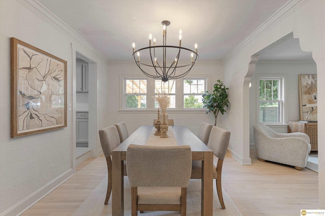 2518 N 56th St, Omaha, NE 68104 - dining room featuring a chandelier, light wood finished floors, and ornamental molding