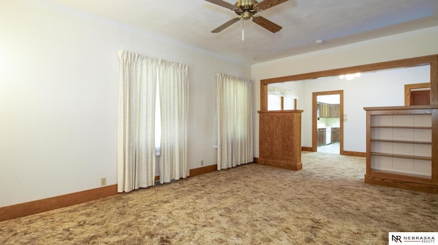 590 Tyler St, Bennet, NE 68317 - empty room with carpet flooring, a ceiling fan, ornamental molding, and a smoke detector