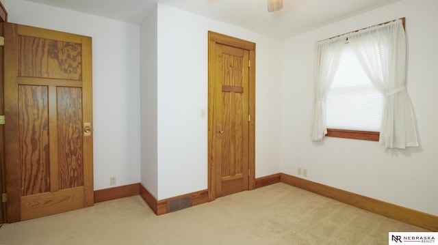 590 Tyler St, Bennet, NE 68317 - unfurnished bedroom with carpet floors and ceiling fan