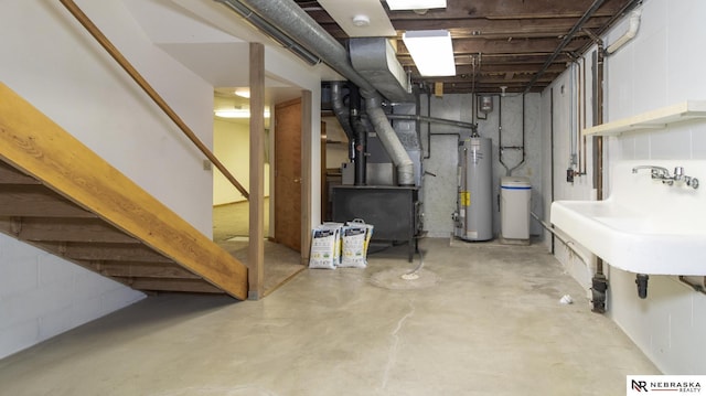 590 Tyler St, Bennet, NE 68317 - unfinished basement featuring gas water heater, heating unit, and stairs