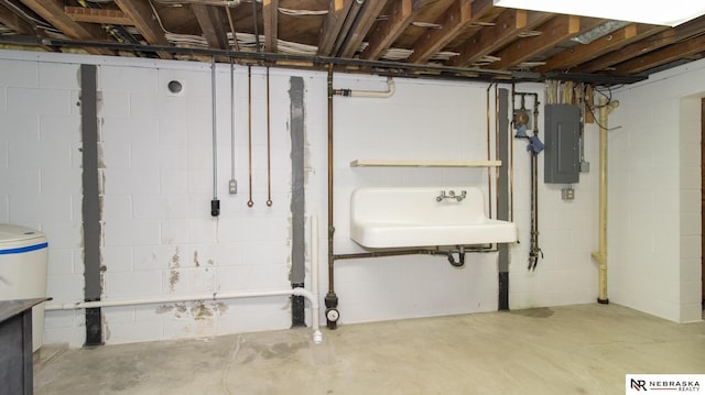 590 Tyler St, Bennet, NE 68317 - unfinished below grade area featuring electric panel and a sink