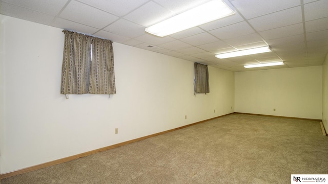590 Tyler St, Bennet, NE 68317 - empty room featuring light colored carpet and a drop ceiling