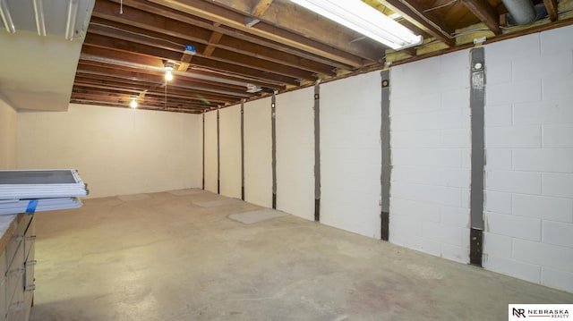 590 Tyler St, Bennet, NE 68317 - unfinished below grade area featuring concrete block wall