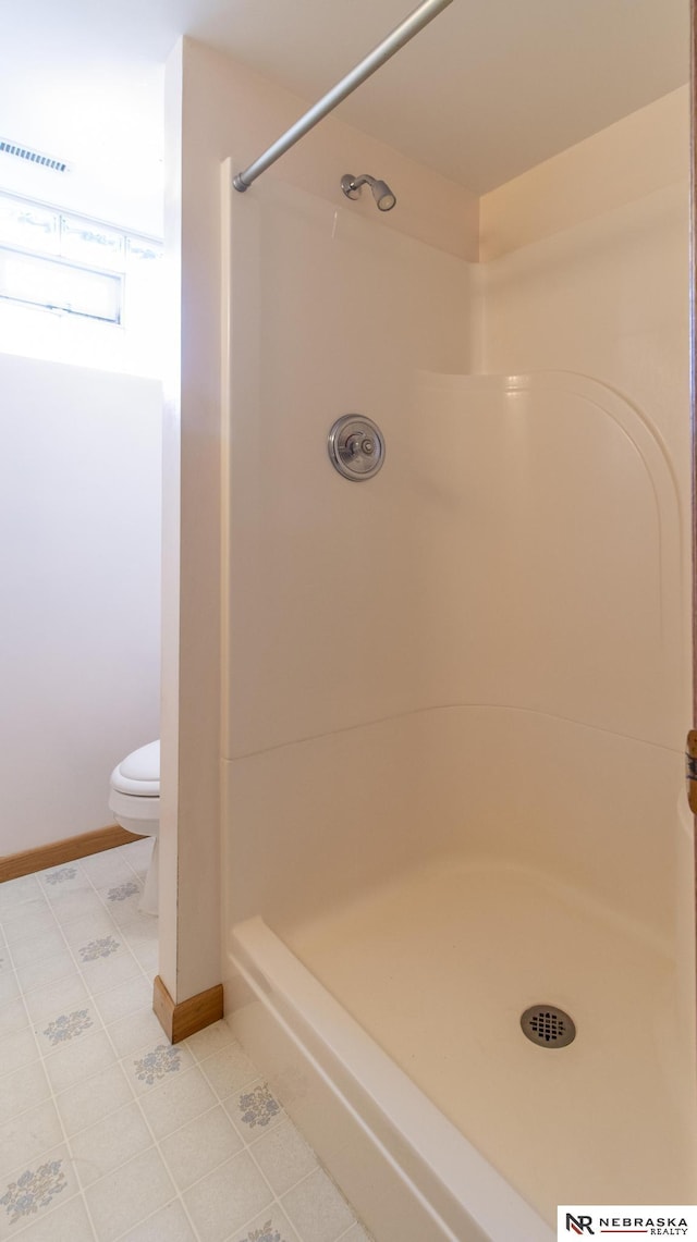 590 Tyler St, Bennet, NE 68317 - bathroom featuring a shower and tile patterned floors