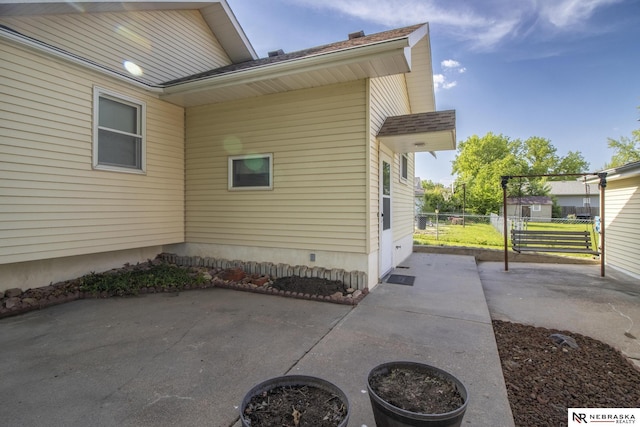 590 Tyler St, Bennet, NE 68317 - view of side of home with a patio and a shingled roof