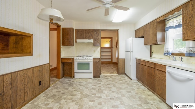590 Tyler St, Bennet, NE 68317 - kitchen with white appliances, under cabinet range hood, open shelves, light countertops, and wallpapered walls