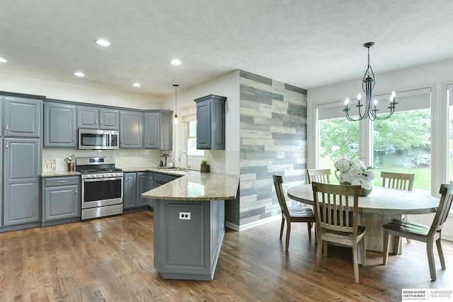 1622 S 179th St, Omaha, NE 68130 - kitchen featuring appliances with stainless steel finishes, gray cabinetry, plenty of natural light, a chandelier, and recessed lighting