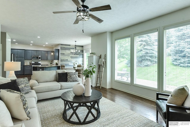 1622 S 179th St, Omaha, NE 68130 - living room featuring healthy amount of natural light, a ceiling fan, a chandelier, recessed lighting, and dark wood-style floors