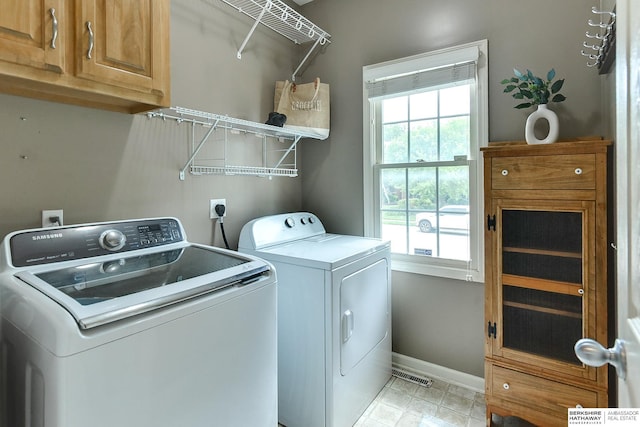 1622 S 179th St, Omaha, NE 68130 - laundry area with cabinet space, washing machine and dryer, and plenty of natural light
