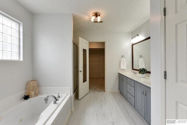 1622 S 179th St, Omaha, NE 68130 - full bathroom featuring double vanity, a whirlpool tub, and a shower with shower door