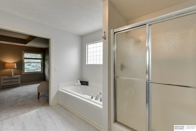 1622 S 179th St, Omaha, NE 68130 - bathroom featuring a bath, a shower stall, and plenty of natural light