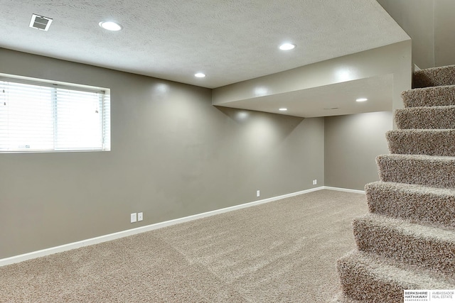 1622 S 179th St, Omaha, NE 68130 - basement with carpet floors, stairs, recessed lighting, and a textured ceiling