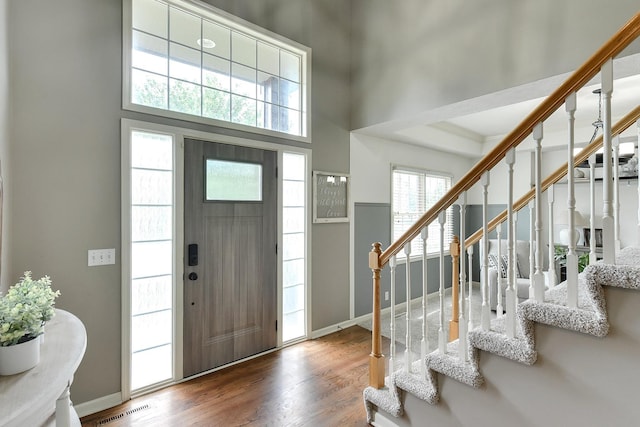 1622 S 179th St, Omaha, NE 68130 - entrance foyer featuring stairway, wood finished floors, and a high ceiling