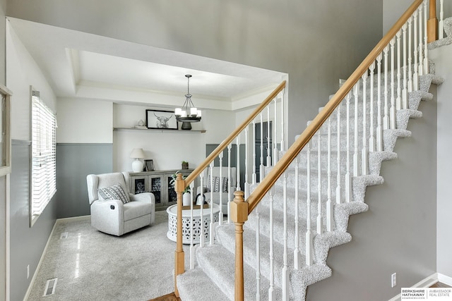 1622 S 179th St, Omaha, NE 68130 - stairway featuring baseboards and a chandelier