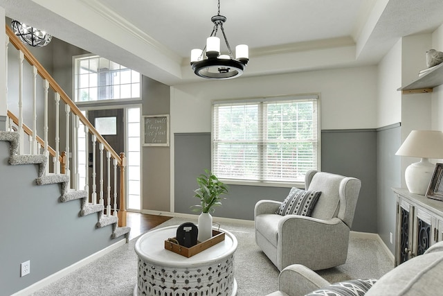 1622 S 179th St, Omaha, NE 68130 - living area with a chandelier, carpet floors, stairs, crown molding, and a tray ceiling