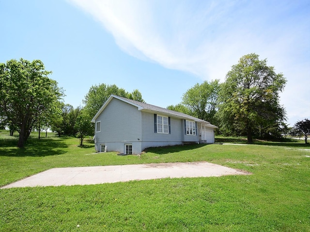 9105 Olive Creek Rd, Hickman, NE 68372 - view of property exterior with a lawn and an attached garage