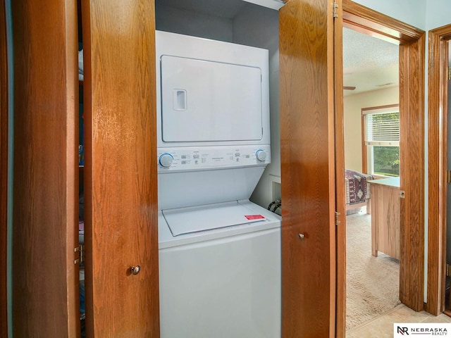 2425 Folkways Blvd Unit 211, Lincoln, NE 68521 - laundry area with estacked washer and dryer