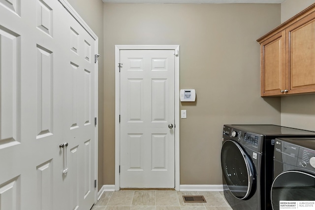 408 S 197th St, Omaha, NE 68022 - washroom with washing machine and dryer and cabinet space
