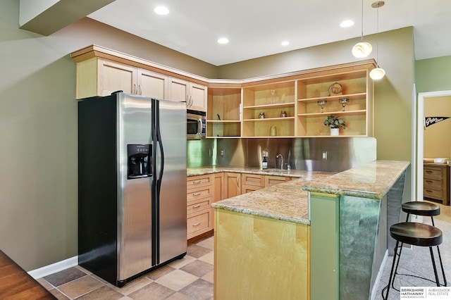 408 S 197th St, Omaha, NE 68022 - kitchen with stainless steel appliances, open shelves, a peninsula, light stone counters, and light brown cabinets