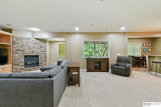 408 S 197th St, Omaha, NE 68022 - living room with light carpet, a stone fireplace, and recessed lighting