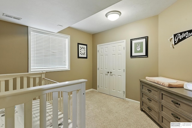 408 S 197th St, Omaha, NE 68022 - bedroom featuring light colored carpet, a closet, and a crib