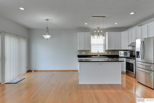 16332 Patrick Ave, Omaha, NE 68116 - kitchen featuring appliances with stainless steel finishes, decorative backsplash, white cabinets, dark countertops, and recessed lighting