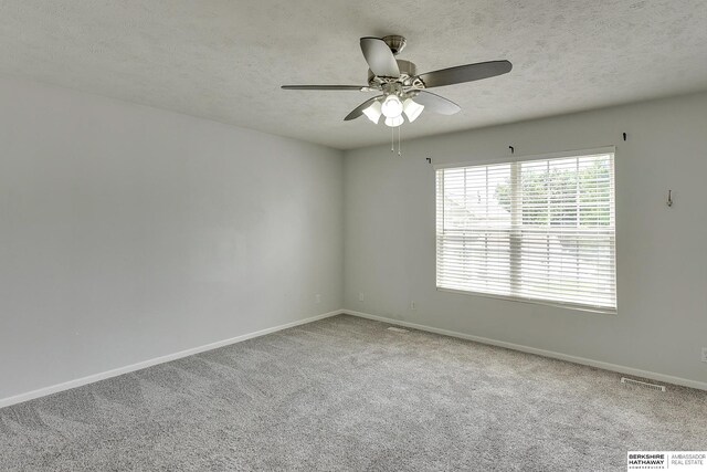 16332 Patrick Ave, Omaha, NE 68116 - unfurnished room featuring a textured ceiling, ceiling fan, and carpet floors