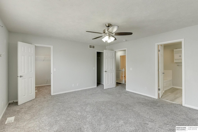 16332 Patrick Ave, Omaha, NE 68116 - unfurnished bedroom with carpet flooring, ceiling fan, a spacious closet, and ensuite bath