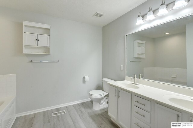 16332 Patrick Ave, Omaha, NE 68116 - full bathroom featuring a bath, wood finished floors, and double vanity