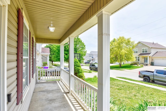 16332 Patrick Ave, Omaha, NE 68116 - covered porch with a residential view and a yard
