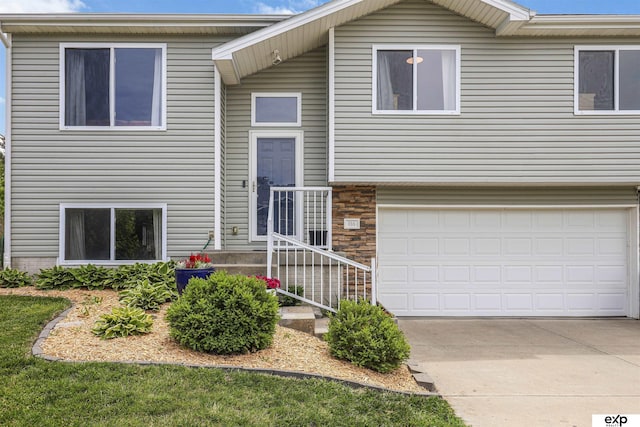 155 Vince Dr, Bennet, NE 68317 - raised ranch featuring a garage and driveway