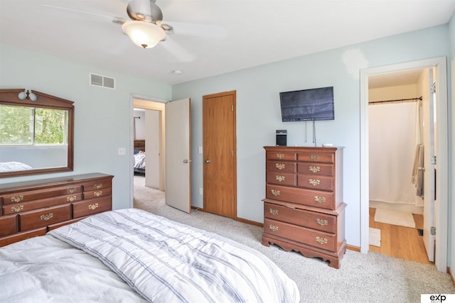 155 Vince Dr, Bennet, NE 68317 - bedroom featuring light carpet, ensuite bath, and a ceiling fan