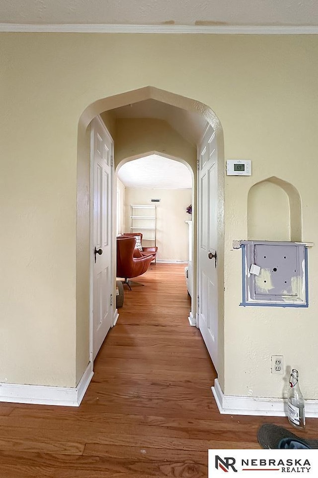 3340 N 48th Ave, Omaha, NE 68104 - corridor with arched walkways, wood finished floors, and ornamental molding