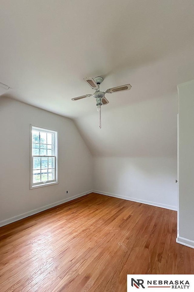 3340 N 48th Ave, Omaha, NE 68104 - additional living space with lofted ceiling, a ceiling fan, and light wood-type flooring