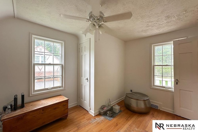 3340 N 48th Ave, Omaha, NE 68104 - entrance foyer featuring light wood-style floors, ceiling fan, and a textured ceiling